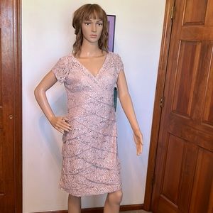 Ladies short length formal dress. NWT. Color Champagne. Size 6.